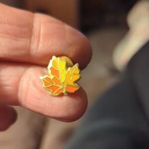 Vintage 1983 Hallmark Cards enamel lapel pin in the shape o autumn maple leaf